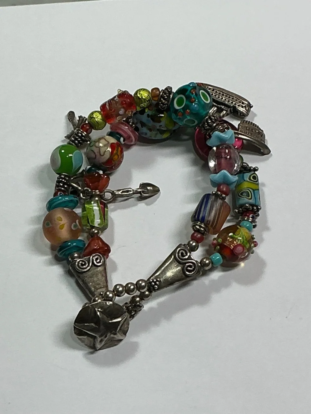Sterling Silver and Lampwork glass beads W/ 4 Sterling Silver charms. 7.5” long